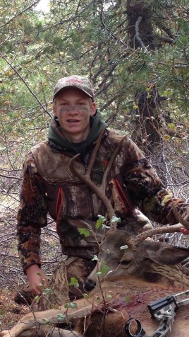 Teenage trifect - boy with deer - optimized.jpg